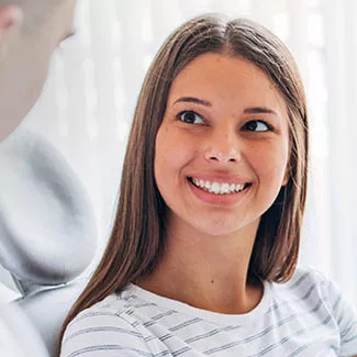 Patient conversing with dentist